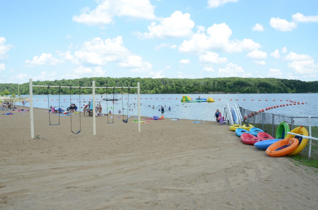 Milnot beach sand, water toys, and swingset.