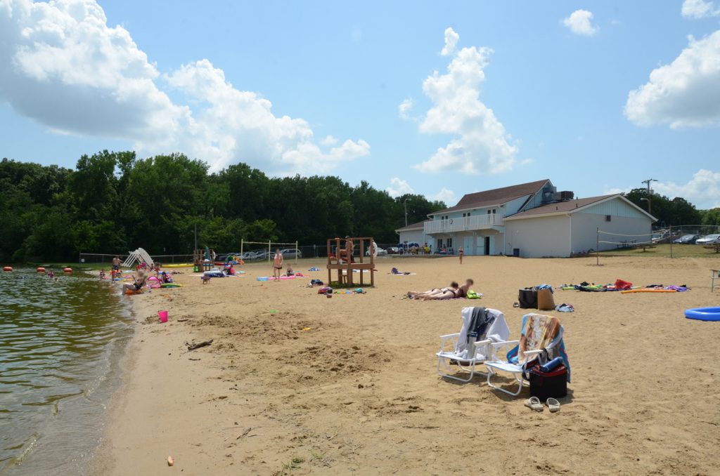 Chairs and towels set up on the sand at Milnot Beach